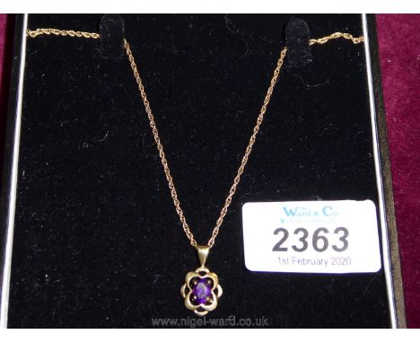 A 9ct gold Pendant and chain with purple stone