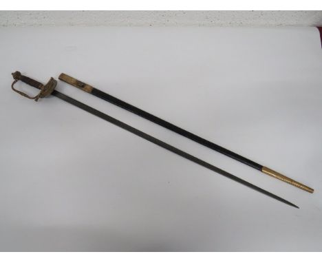 Victorian Officer's Court Sword 32 inch, double edged, narrow blade.  Etched foliage and crowned VR cypher.  Brass downswept 