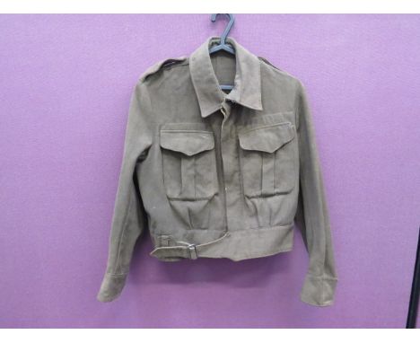 1942 Dated Australian Made Battle Dress Jacket khaki green, single breasted, closed collar, short jacket.  Lower extended bel
