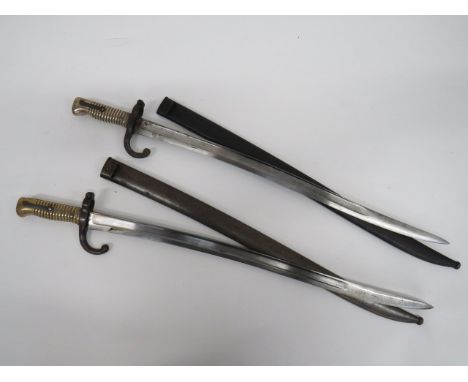 Two French M1866 Chassepot Sabre Bayonets single edged Yataghan blades with large fullers.  Back edges with maker's details d