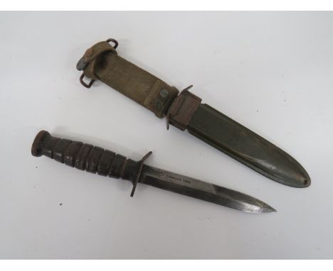 WW2 American M3 Combat Knife single edged blade with sharpened back edge point.  Blade stamped 'US M3 Camillus 1943'.  Steel 