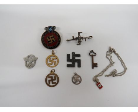 Small Selection of Swastika Items consisting 2 x gilt swastika pendants ... Silver swastika pendant ... Silvered and enamel s