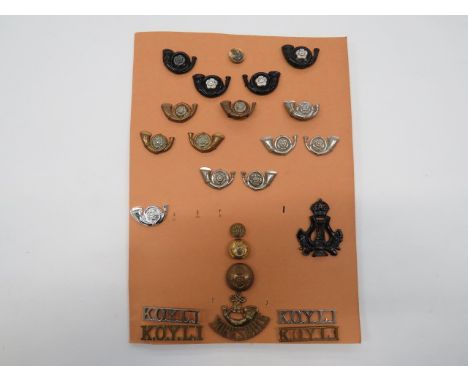 Selection of KOYLI Badges cap badges include blackened and silvered (1 blade absent) ... Plastic and silvered (lugs) ... Bi-m