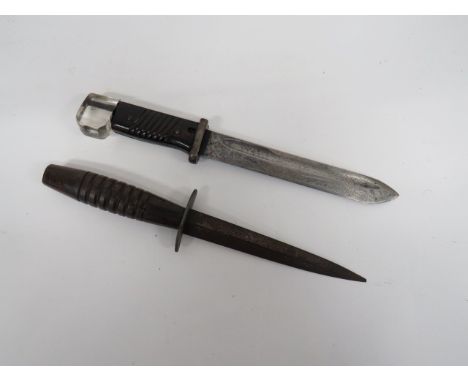 Wooden Handle F/S Commando Knife 6 3/4 inch, double edged blade.  Steel oval crossguard.  Turned 7 ring wooden grip.  Some ru