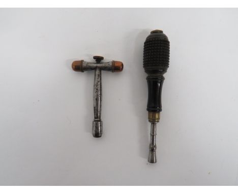Two Various Continental Gun Tools consisting T shape steel tool.  Both arms with copper screw off caps.  The top with brass h