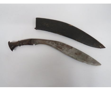 Late 19th Century Kukri 15 1/2 inch, single edged blade of typical form.  Double back edge fuller.  Steel ferrule and flat po