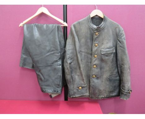German Third Reich Kreigsmarine Leather Jacket and Trousers black leather, single breasted, short high collar tunic.  Hidden 