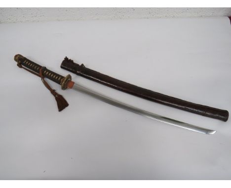 Japanese Officer's Showa Katana Sword with Signed Tang 24 1/2 inch, single edged blade with wavy hammon. Copper habaki. Signe