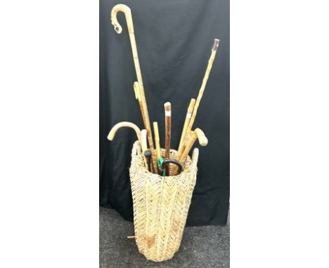 Selection of walking sticks and a walking stick stand 