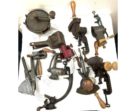 Selection vintage tools to include a fruit press, knife sharpener, Potato ricer, meat grinder etc 
