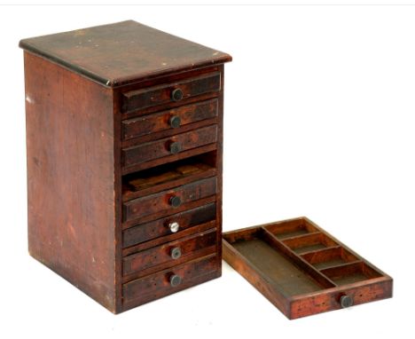 A painted wood tool chest, of eight drawers, with lead knobs, 52cm h; 31cm x 58cm  One of the lead knobs replaced, in ex work