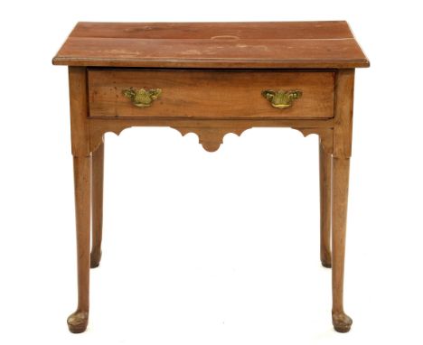 A George III walnut side table on turned legs and pad feet, 70cm h; 49 x 74cm  Top with ring and other stains, knocks and scr