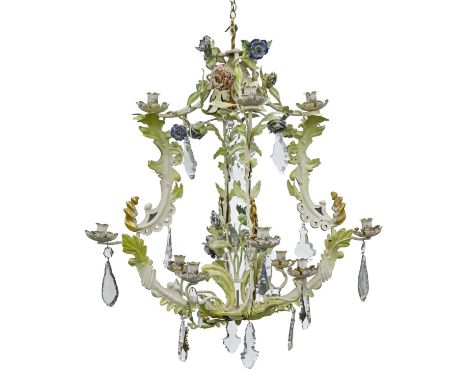 A naturalistic painted metal chandelier, late 20th c, of eight lights, issuing from leafy branches and centred by a group of 