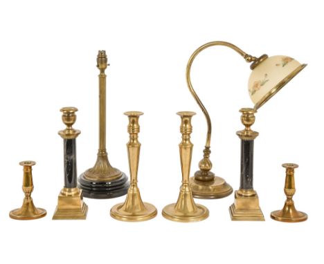 Three pairs of brass candlesticks, early 20th c and later, 31cm h and smaller, a brass Corinthian column table lamp, on black