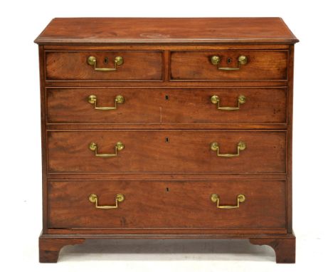 A George IV mahogany chest of drawers, the brass locks and handles original, 82cm h; 48 x 91cm  Top with a number of ring and