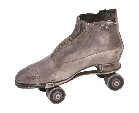 An Edwardian silver roller skate novelty pin cushion, 68mm l, by Crisford &amp; Norris, Birmingham 1909  dented in several pl