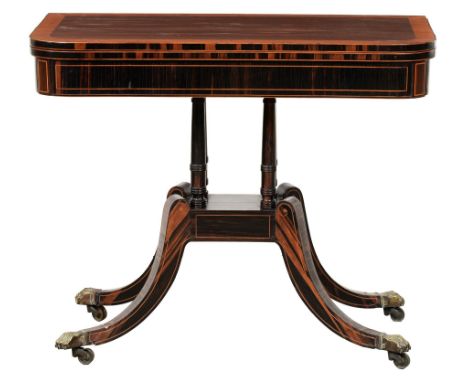 A George IV zebrawood card table,  crossbanded in satinwood, on ring turned pillars, block and four downswept legs terminatin