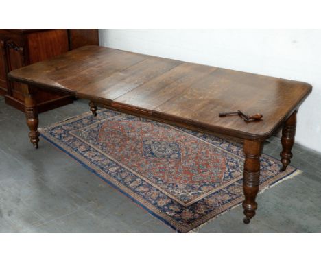 A Victorian oak dining table,&nbsp; with ring turned legs, winding handle, 73cm h; 105 x 213cm  A useable table in sound cond