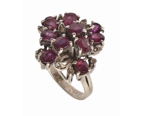 A ruby and diamond ring in white gold coloured metal, 5.5g, size H  wear scratches on metal, cluster slightly bent