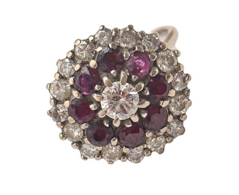 A ruby and diamond ring in white gold, indistinctly marked, 5.9g, size L  Complete and in good condition apart from some very