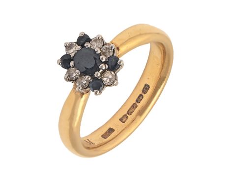 A sapphire and diamond ring,&nbsp; the cluster on associated 22ct gold wedding ring, Birmingham 1928, 8.2g, size O  