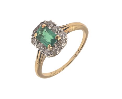 An emerald and diamond ring,&nbsp;4 x 6mm emerald, gold hoop marked PLAT 18c, 3g, size M  Hoop slightly thin.  Emerald with o