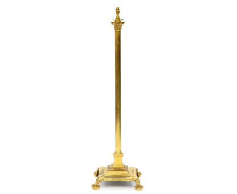 An Edwardian brass columnar telescopic oil lamp stand, on four feet, adapted for electricity, 125cm h excluding fitment  Lacq