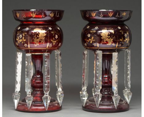 A pair of ruby flashed gilt and white enamel glass lustres, late 19th c,  hung with prismatic cut pendants, 31cm h  Typical w