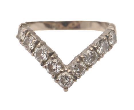 A diamond dart ring,&nbsp; in white gold, marked 18ct, 3.2g, size L  Good condition