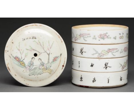 A Chinese porcelain stacking box, 19th century, the cover painted with the figures of two women reclined under blossom trees,