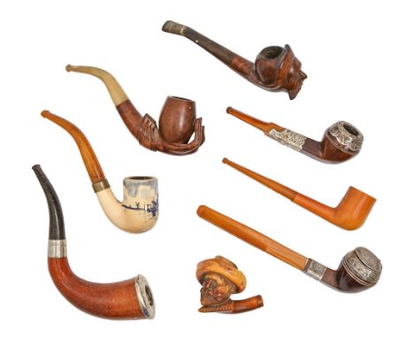 A Victorian silver mounted tobacco pipe, Birmingham 1889, with amber mouthpiece, 18cm l, another smaller example, Birmingham 