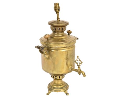 A brass samovar, early 20th c, with twin turned wood handles, adapted as a table lamp, 41cm h  Solder repair to base, dents a