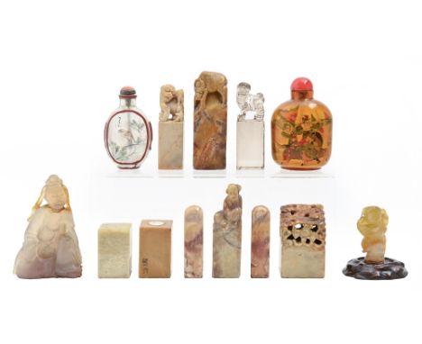 A collection of Chinese stone works of art, several possibly 19th c, including several seals, one of rock crystal and two int