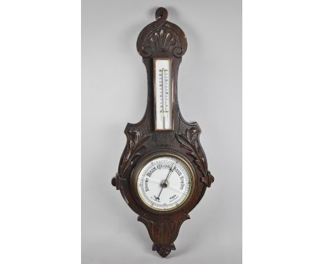 A Late Victorian Oak Framed Wheel Barometer with Thermometer, Carved Foliate Decoration, Glass Cracked 