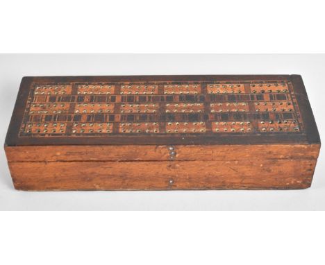 A Late 19th Century Inlaid Wooden Box with Cribbage Board Top Containing Six Spot Bone Mounted Dominoes, 25.5cms Wide 