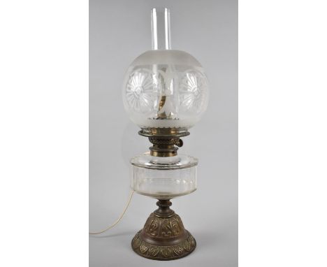 A Late Victorian Brass Based Oil Lamp, Now Converted to Electricity, Glass Reservoir and Etched Globe Shade, 54cms high 
