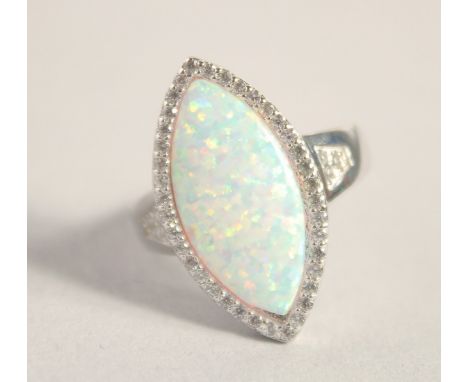 A SILVER GILSON OPAL RING.