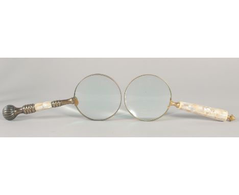 TWO MAGNIFYING GLASSES with mother of pearl handles.