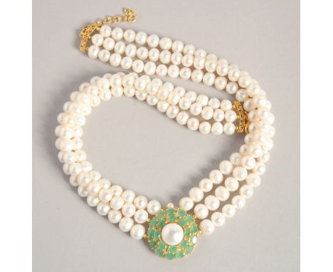 A PEARL NECKLACE with GOLD PLATED ELEPHANT CLASP.