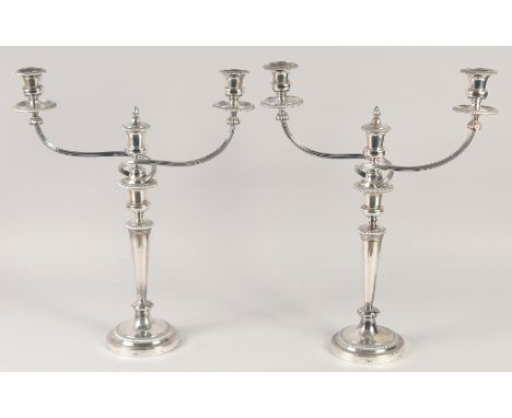 A GOOD PAIR OF MATTHEW BOLTON SHEFFIELD PLATE THREE LIGHT CANDELABRAS, circular bases, tapering columns with gadrooned border