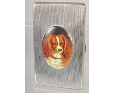 A GOOD LARGE HEAVY ENGINE TURNED CIGARETTE CASE with and oval enamel of a King Charles Spaniel. 5.5ins x 3ins 242gms. Birming