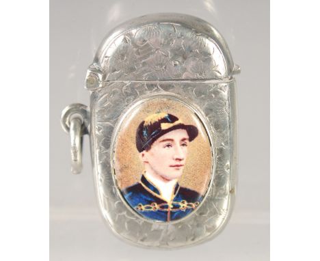 A VICTORIAN ENGRAVED SILVER VESTA CASE with an oval enamel of the jockey, Fred Archer. 1.75ins x 1in. Birmingham 1894.