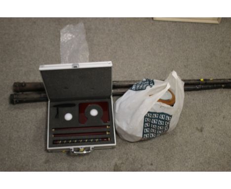 TWO CASED VINTAGE SNOOKER CUES TOGETHER WITH A CASED PUTTING GAME AND A BAG OF ANTIQUE CURTAIN RINGS