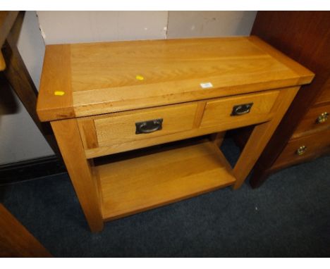 A MODERN LIGHT OAK TWO DRAWER CONSOLE TABLE