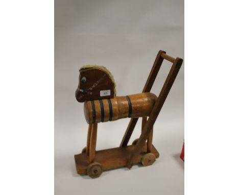 A VINTAGE WOODEN CHILD PUSH ALONG HORSE TOY