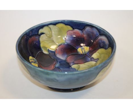 A VINTAGE MOORCROFT FLORAL FOOTED BOWL 