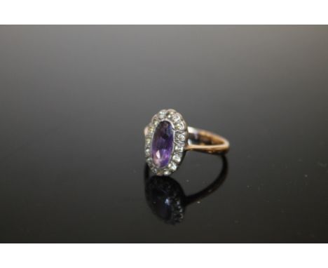 A 9CT GOLD AMETHYST AND DIAMOND RING 