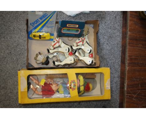 A BOXED PELHAM PUPPET TOGETHER WITH TWO TIN PLATE HORSE PUPPETS AND TWO TOY CARS