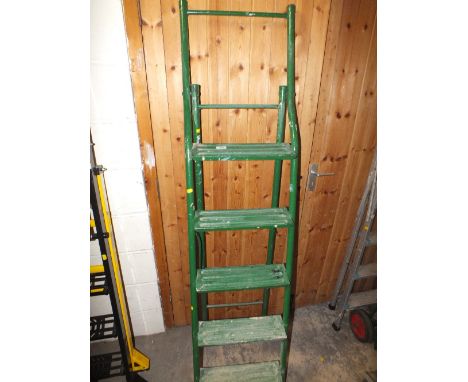 A SET OF GREEN STEP LADDERS