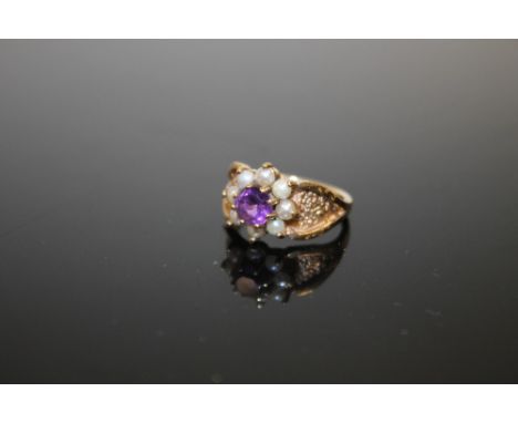 A HALLMARKED 9CT GOLD AMETHYST AND SEED PEARL DRESS RING 